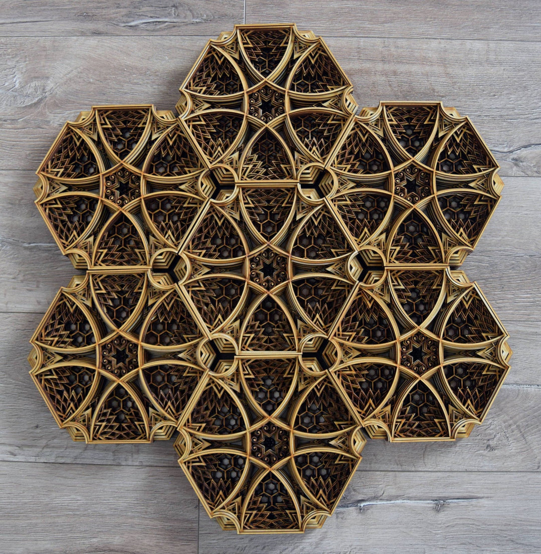 Hexagonal wooden mandala with intricate laser-cut layers and geometric pattern