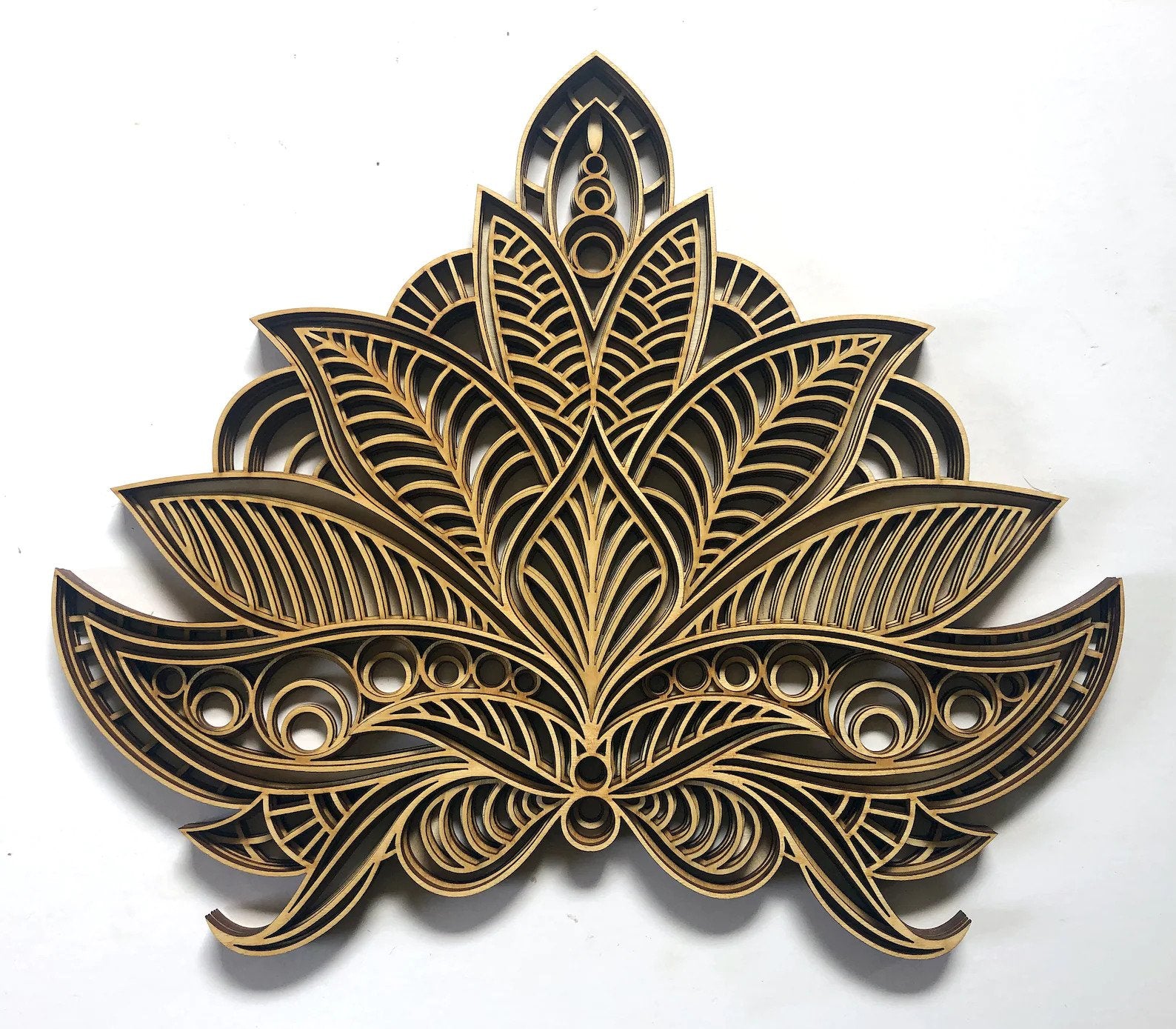 Wooden lotus mandala with laser-cut layered petals, blue–gold accents