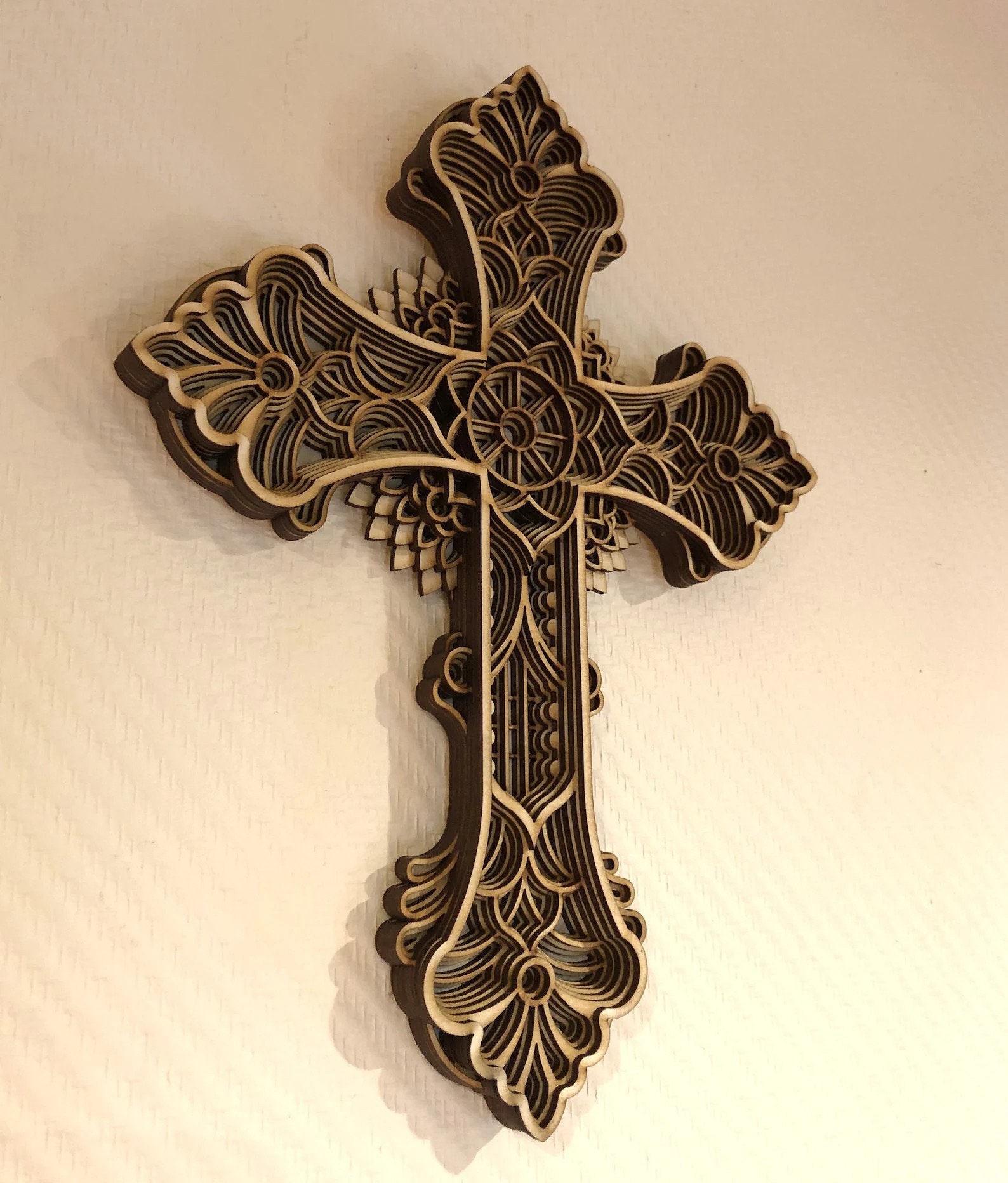 3D layered wooden cross wall art with intricate laser-cut details