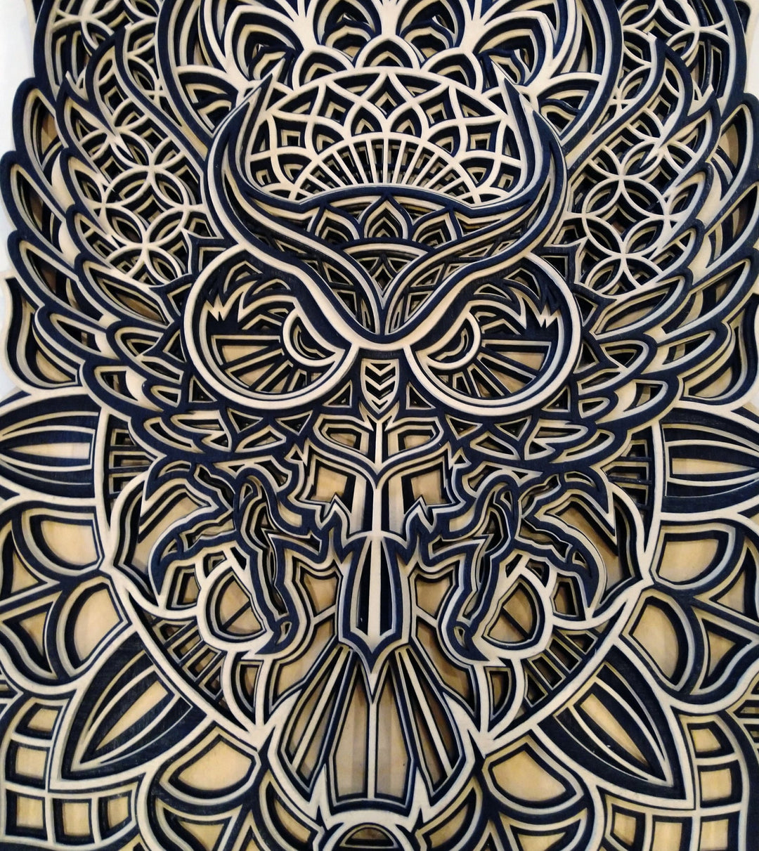 Spiritual wooden owl mandala