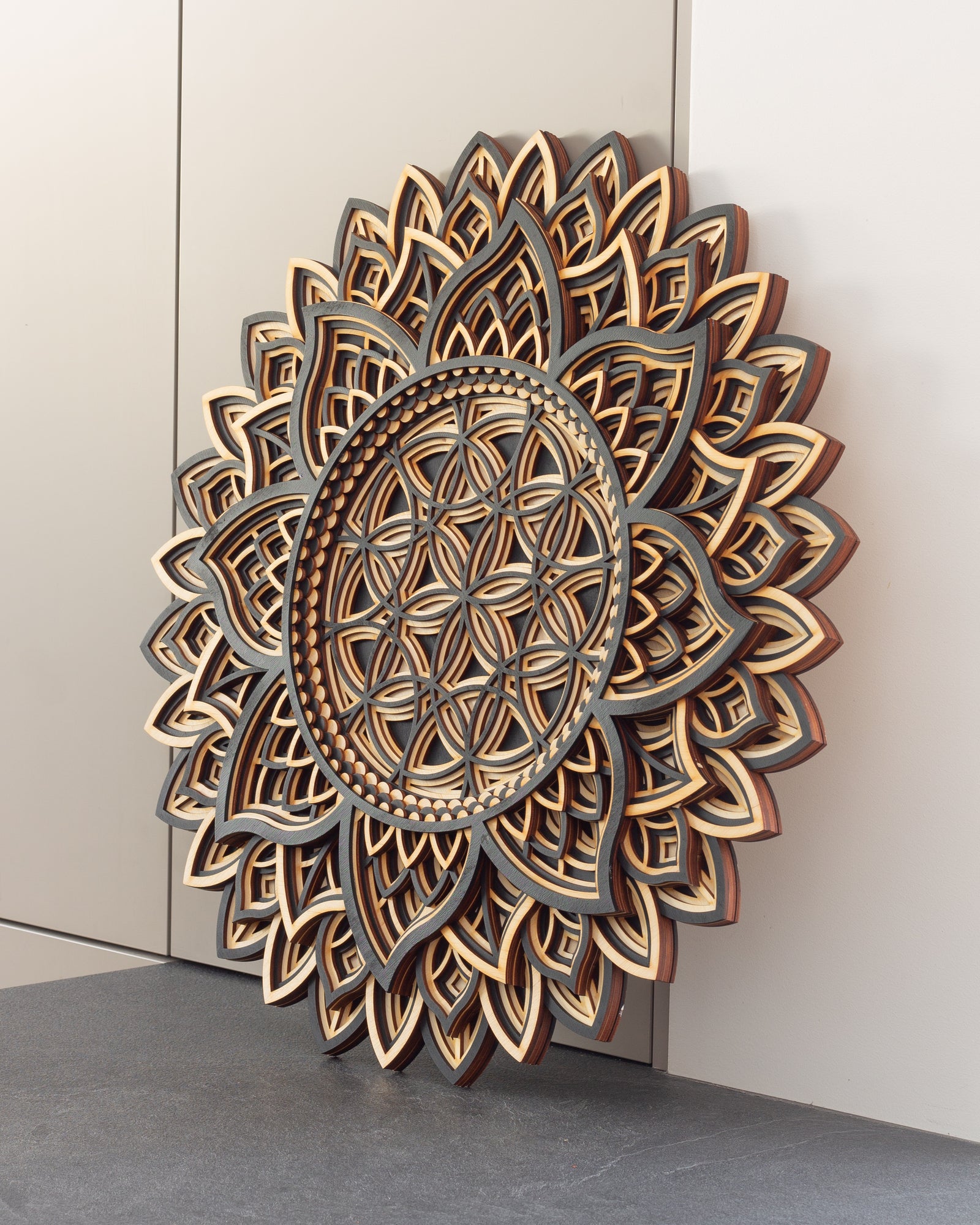 Yin Yang mandala in wood, 3D laser-cut symbol with sun and sea curls
